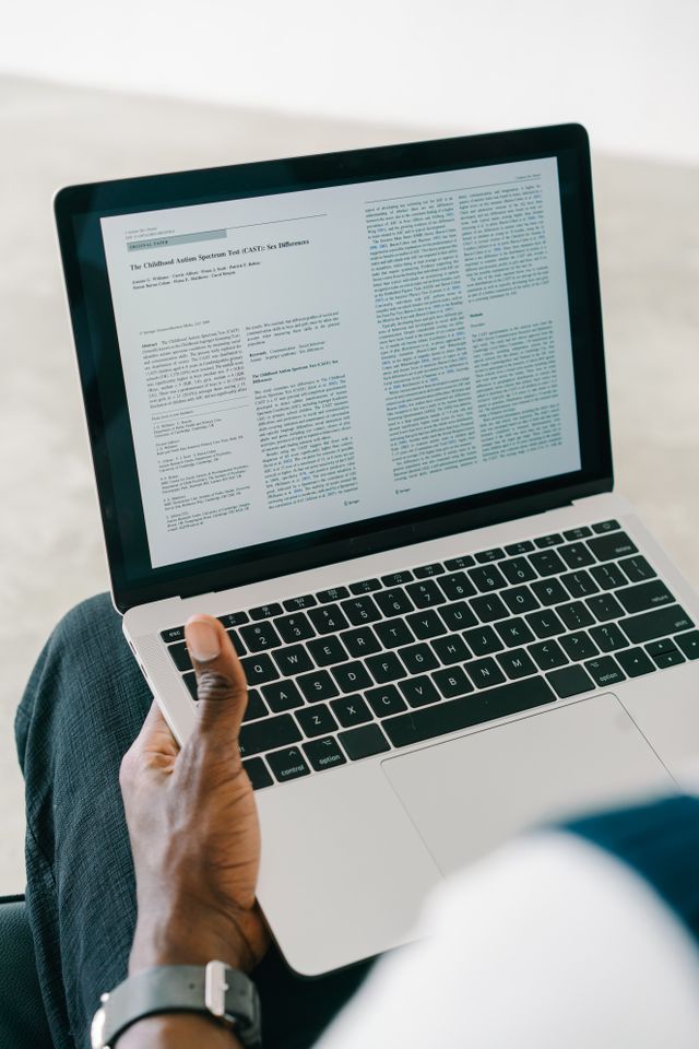 Reviewing a published report on a laptop