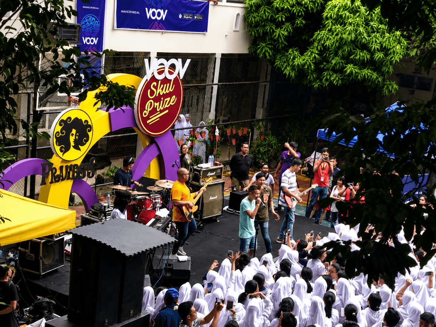 Live band performing at a school roadshow campaign