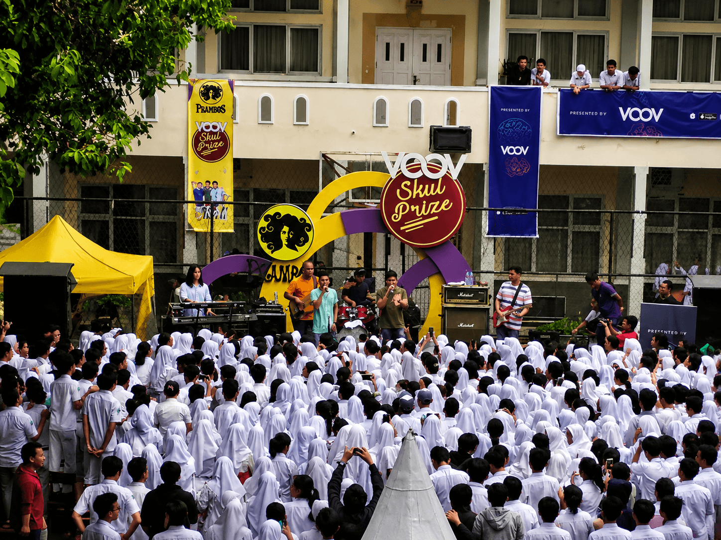 Wide view of student audience at a school roadshow